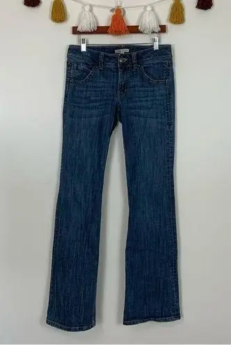 CAbi  Mid Rise Flare Leg Medium Wash Jeans Size 6