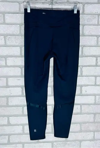 Sweaty Betty The Zero Gravity Illuminate Running Leggings in Dark Gray Size M