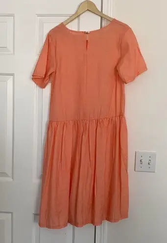 Sign Here Signature Clothing drop waist dress in pastel peach.