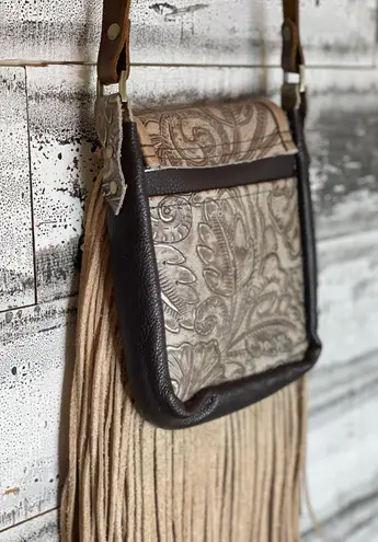 Deep brown and golden browns are stunning on this leather crossbody purse.