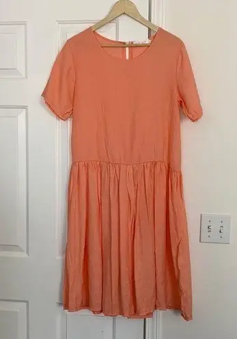 Sign Here Signature Clothing drop waist dress in pastel peach.