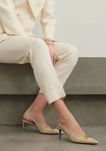 Dolce & Gabbana
Logo-embellished raffia slingback pumps