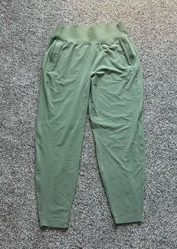 Athleta green Run with It jogger wind pants size S