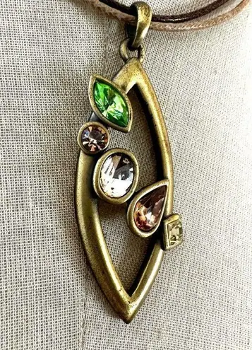 Gold tone rhinestone pendant necklace on cord