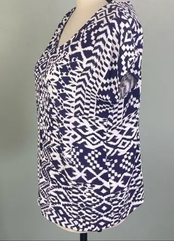 Skies Are Blue navy and white top with back cut-outs in size Medium. EUC
