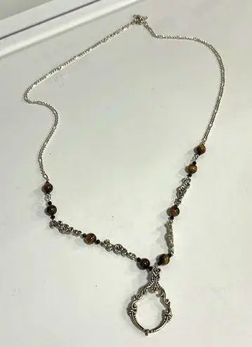 Costume jewelry necklace can be used as a eyeglass holder