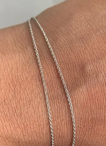 18k white gold chain with 14k gold solitaire charm