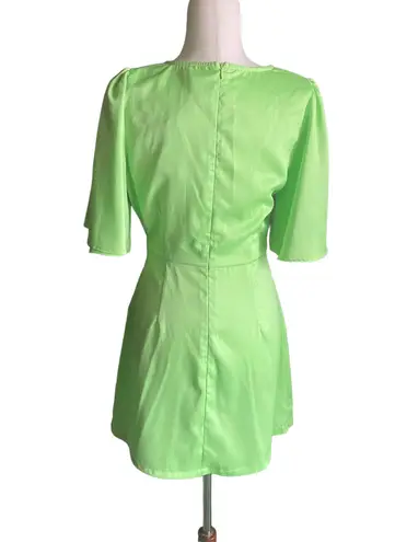 Glam NWT--GORGEOUS BRIGHT GREEN DRESS-SIZE MEDIUM Beautiful wrap top dress, short bell sleeves, ties at waist, back zipper, brand new Measurements: Bust: armpit to armpit 19 inches  Waist: side to side 15 inches  Length: shoulder seam to bottom 33 inches