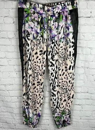 Bebe  Floral Animal print blend joggers with faux leather side pockets. Size M