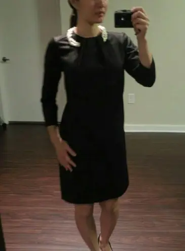 Black dress w faux pearl necklace. Size XS