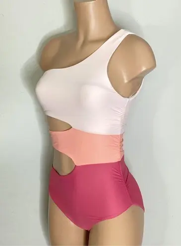 PilyQ New.  peach/pink cut out one piece. Medium   Retails $144