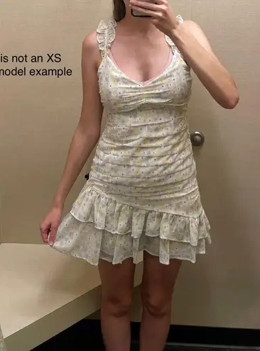 Elodie pastels Spagetti strap ruffled floral print mini dress