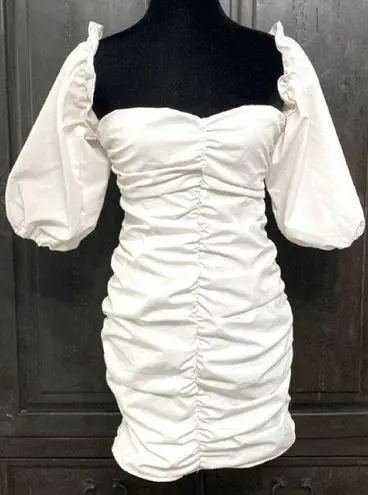 White dress with attached short Puffy sleeves