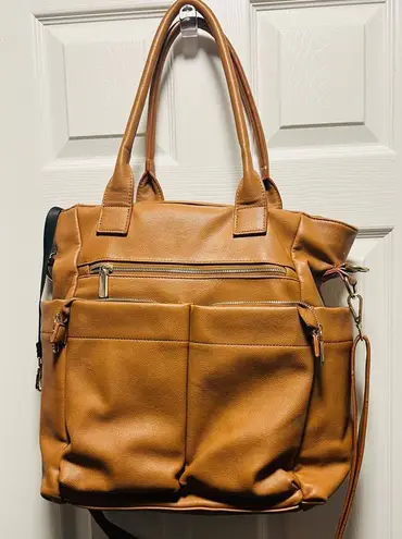 Brown patent leather diaper bag with multiple pockets and key holders