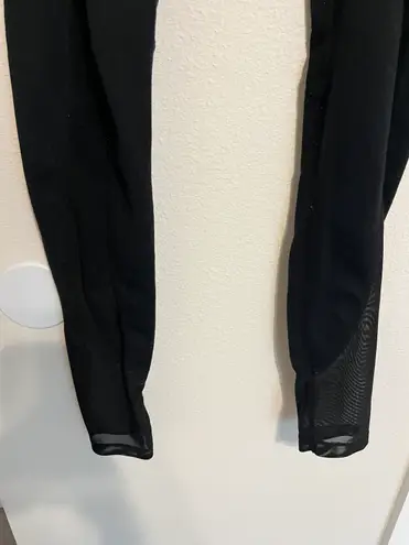 Gymshark black leggings with mesh down sides and pockets