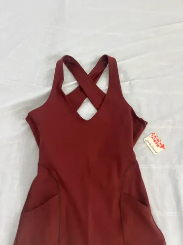 Free People Movement Here On Out Strappy Onesie Romper   Size XS  Condition: NWT  Color: nutmeg  Details : - See photo for approx. inseam measurement laying flat  - Built-in bra - not padded - Side pockets.