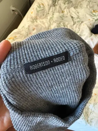 Gray and white padded shoulder sweater