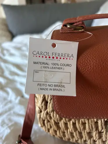 Woven purse with brown leather and gold accents