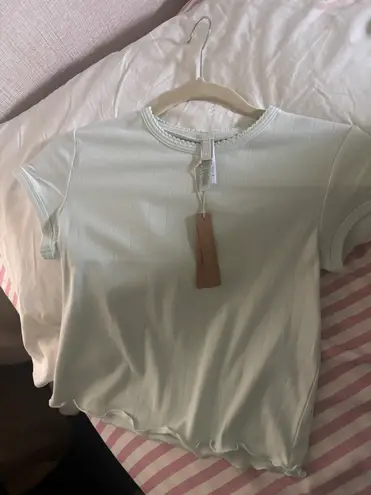 SKIMS Ivory DROP NEEDLE POINTELLE BABY TEE