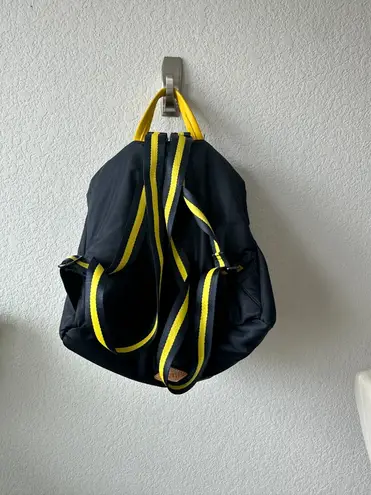 Leather Trim Embellishment & Dual Exterior Pockets