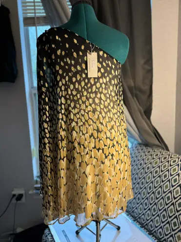 Julie Brown One-shoulder dress with a golden and black abstract print. Lightweight, flowy,