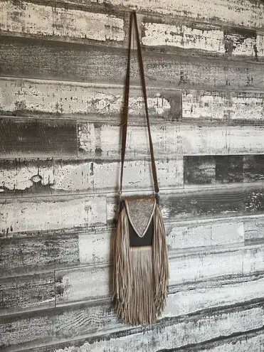 Deep brown and golden browns are stunning on this leather crossbody purse.