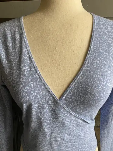 Brandy Melville Beautiful blue with tiny white flowers wrap top, long sleeves, has stretch, excellent condition, size medium Measurements: Bust: armpit to armpit 16 inches  Length: shoulder seam to bottom 17 inches