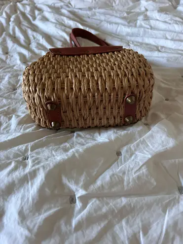 Woven purse with brown leather and gold accents