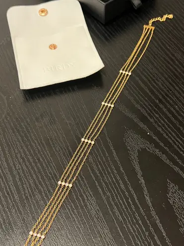 MULTILAYER CHOKER LINKED BY DIAMOND SIMULANT STONES Gold