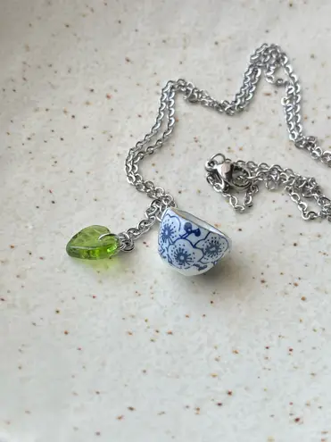 Handmade porcelain tea cup & Czech glass leaf unique fun fairy antique style necklace🫖🍃🌀