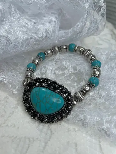 Western women’s faux turquoise and silver stretch bracelets. Blue