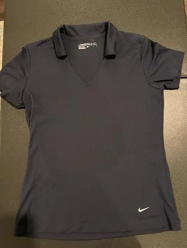 Nike Woman’s navy golf polo