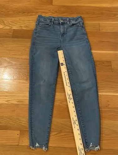 American Eagle  outfitters distressed curvy hi-rise jegging size 4 short .