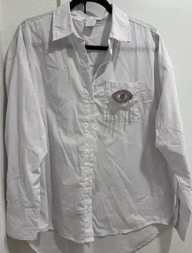 Eye bedazzled detail long sleeve shirt in white and silver Size M