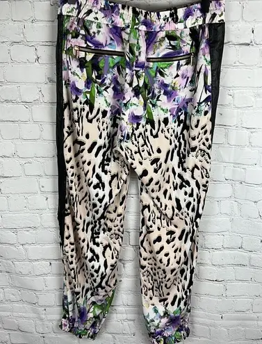 Bebe  Floral Animal print blend joggers with faux leather side pockets. Size M