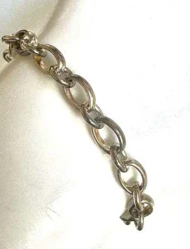 Silver tone locket charm bracelet