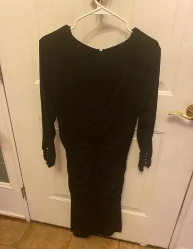 Cache  black dress with studs on cuffs size L