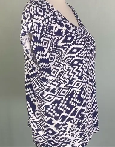 Skies Are Blue navy and white top with back cut-outs in size Medium. EUC