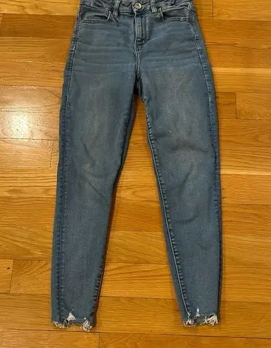 American Eagle  outfitters distressed curvy hi-rise jegging size 4 short .