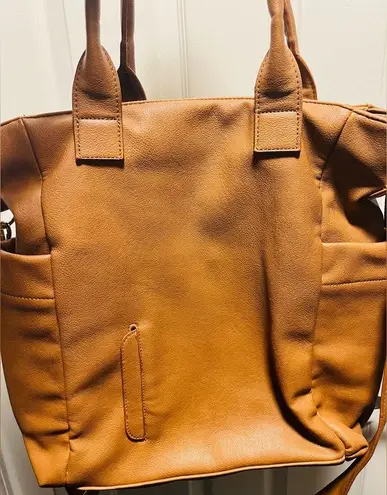 Brown patent leather diaper bag with multiple pockets and key holders