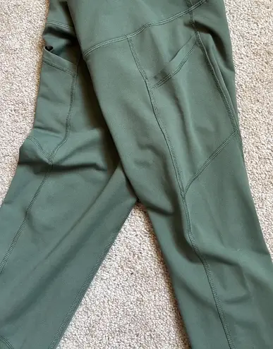 Gaiam Olive Green Leggings With Dual Pockets and Mesh Detailing Around Calves