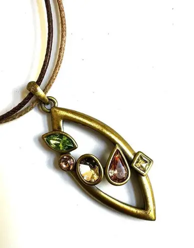 Gold tone rhinestone pendant necklace on cord