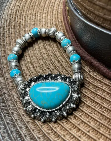 Western women’s faux turquoise and silver stretch bracelets. Blue