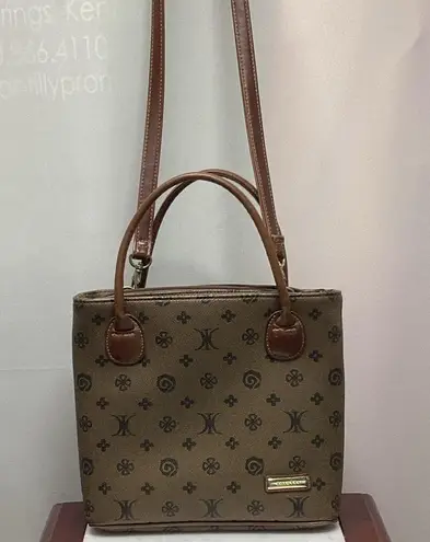 Rosetti purse. Dark taupe with brown leather handles and strap. Super cute