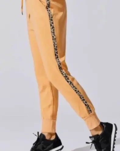 Sundry 
Orange sweat pants with leopard stripe size 1