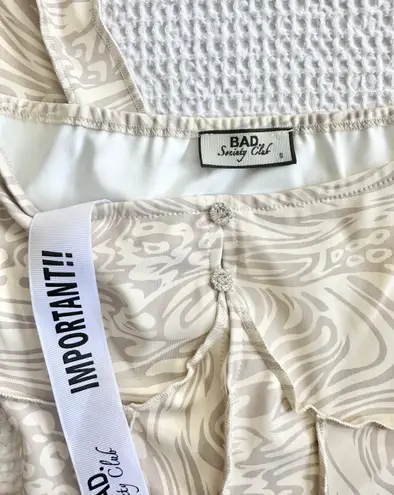 Bad Society Club OFF THE SHOULDER PRINTED JUMPSUIT in cream swirl print