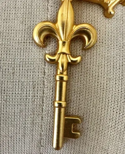 Mud Pie Gold Tone Charm Necklace Crown Key Fleur-de-Lis Purple Crystal