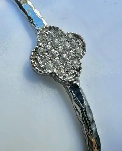 Silver tone clover bangle bracelet