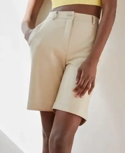 Babaton Aritzia Adrian faux leather high waisted shorts in sand white size 12