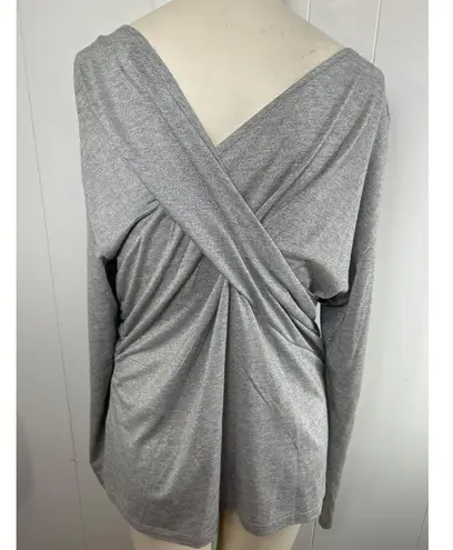 Donna Karen Empire twist top in silver. New without tag size XL.
OK